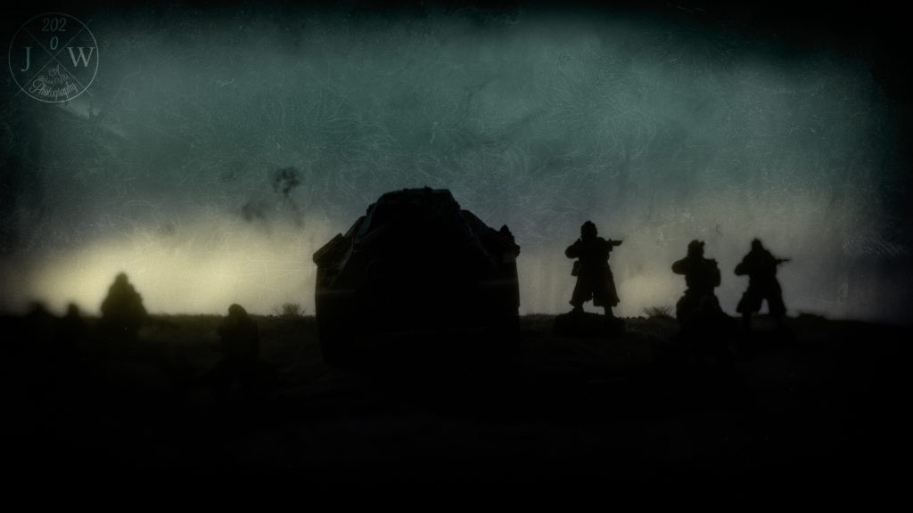 Death Korps of Krieg approach a hill at dusk.